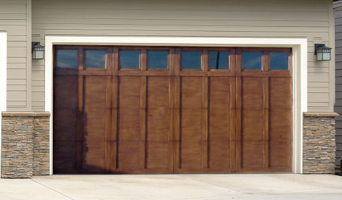 Steel garage door repaired by Level Up